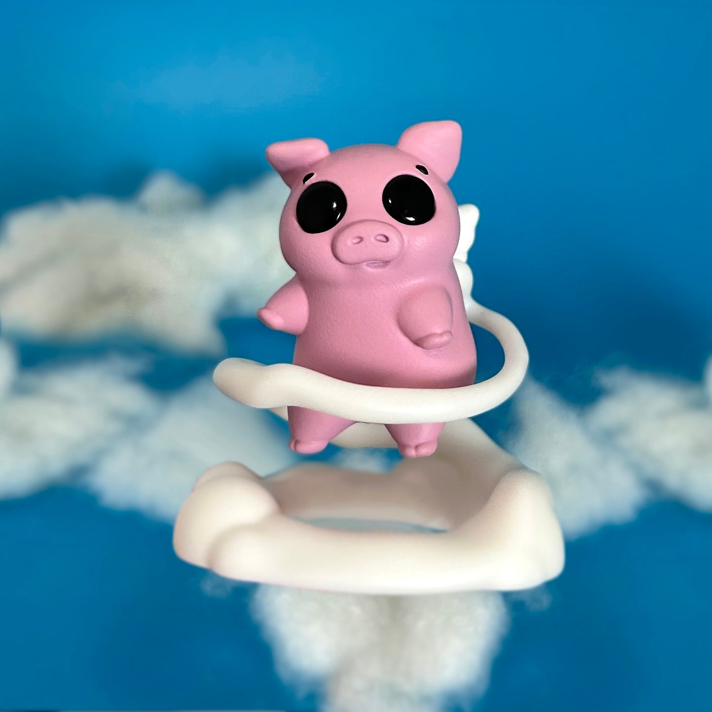 Flying pig figure on cloud stand - front