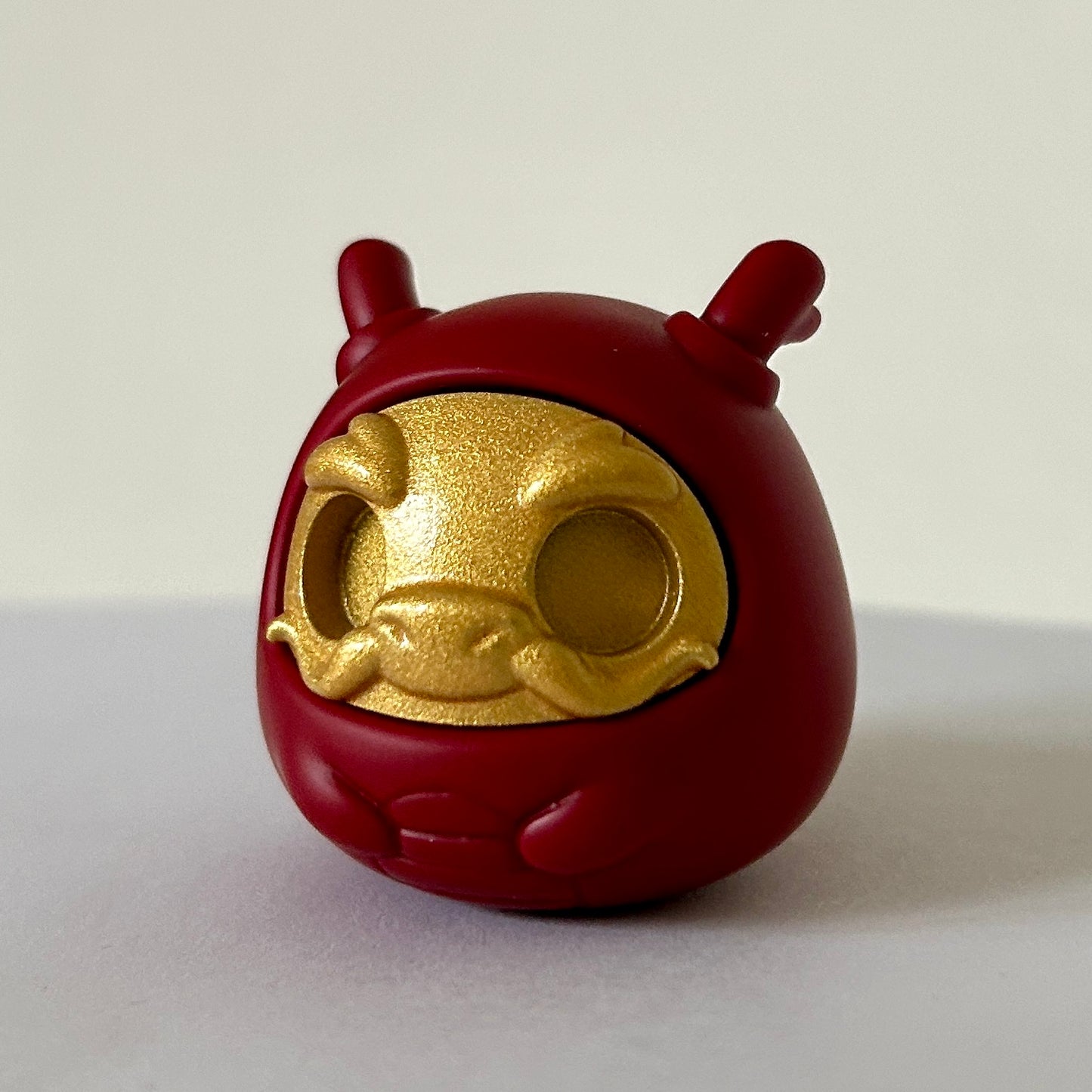 Dragon daruma figurine without eyes