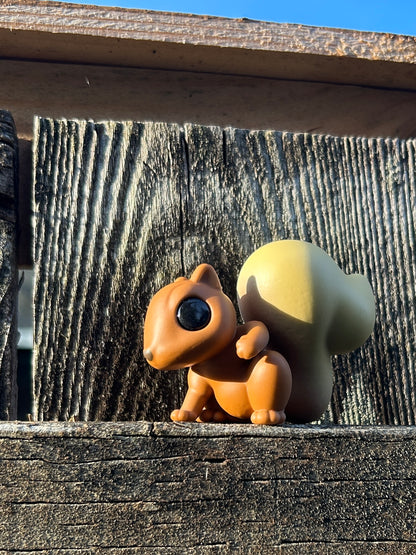 Red squirrel with blonde tail figure